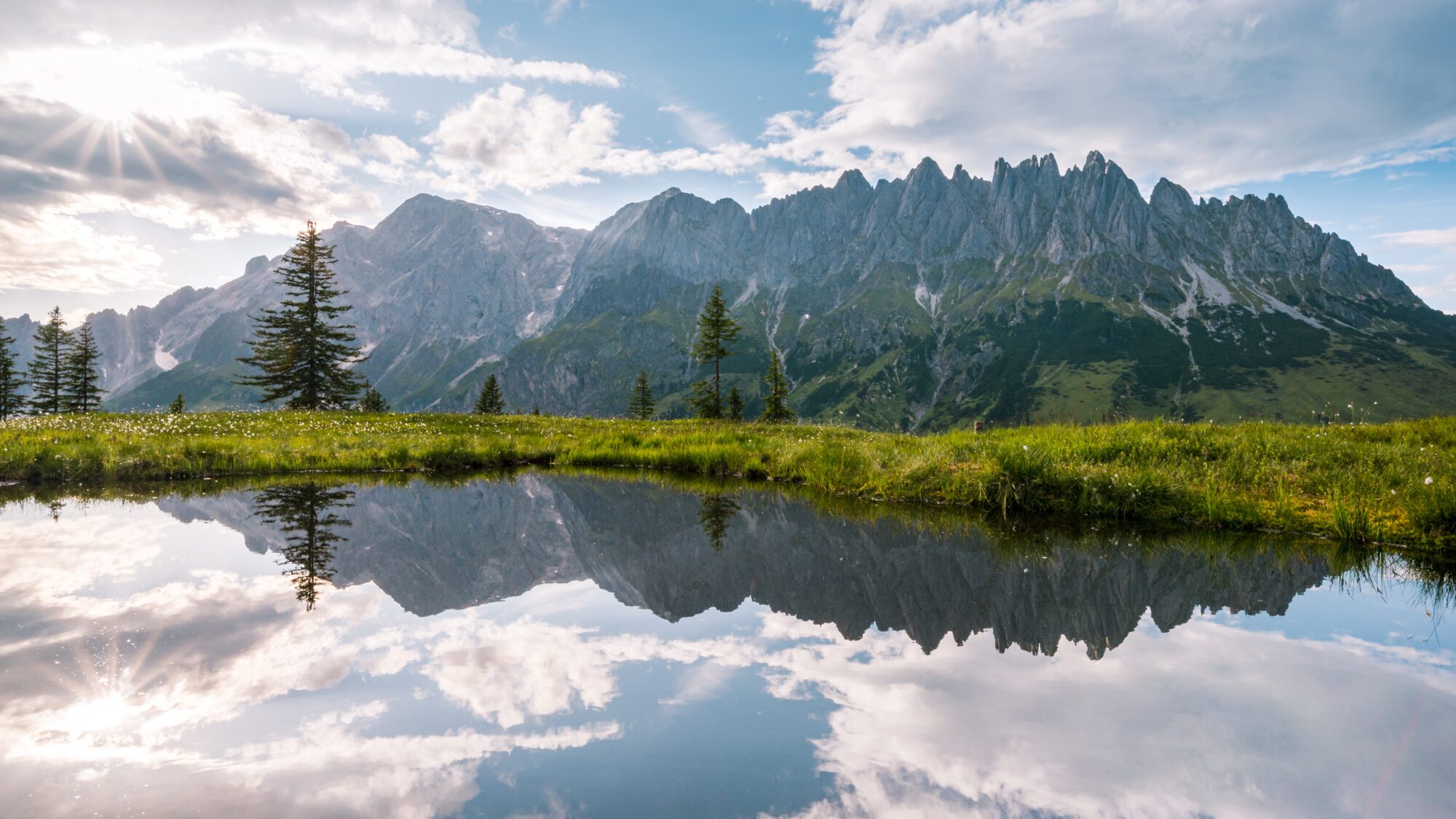 A mountain lake against a beautiful mountain backdrop in the Hochkönig region.