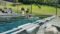 Rilassarsi a bordo piscina con vista sulle montagne della Valle di Gastein: questo è il modo migliore per farlo presso l'hotel escursionistico Gasteiner Einkehr.© Gasteiner Einkehr